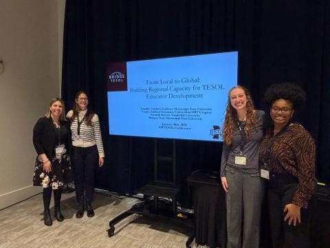 Lourdes Cardozo Gaibisso, Natalia Zambon Ferronato, Savanah Stewart and Morgan Neal presenting the project at the Alabama–Mississippi TESOL Conference, January 2026