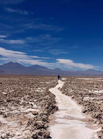 Two people walking down a stone path in Chile.